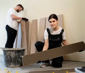 Installers carrying large-format tile panels
