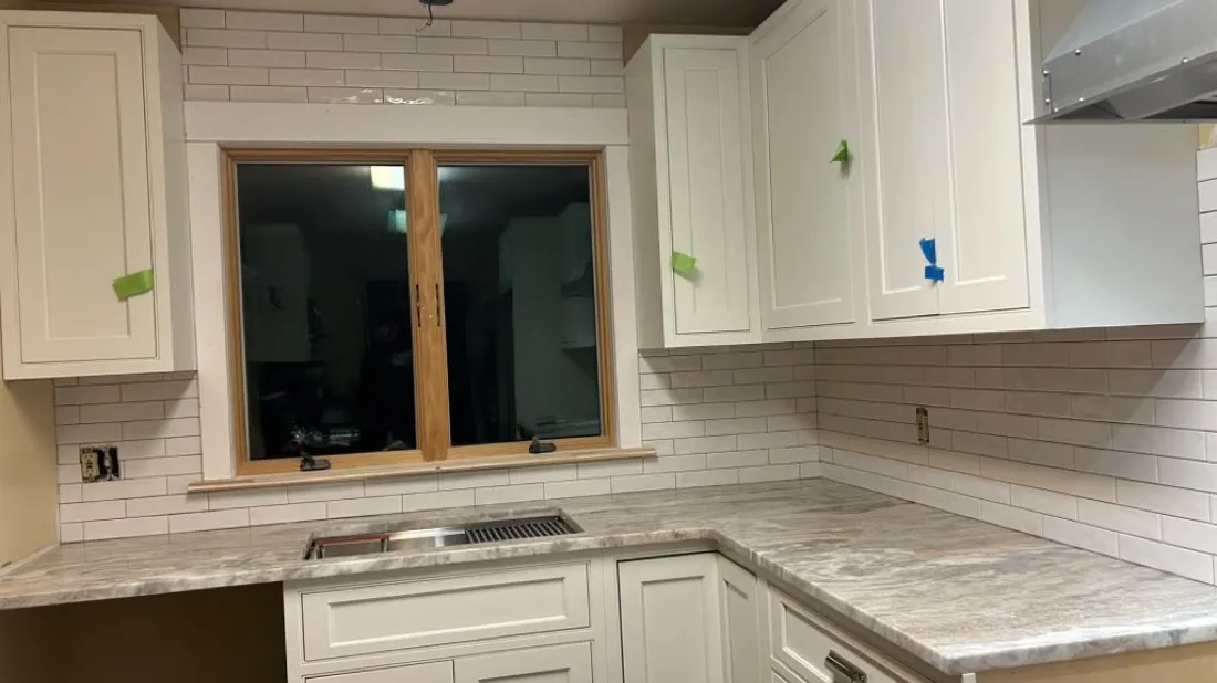 Subway tile backsplash surrounding a kitchen window in Boston, MA